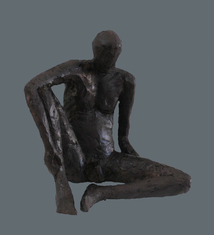 Siddende mand uden sokkel