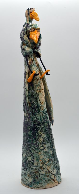 Fugl med barn på søjle