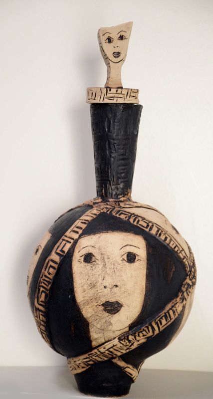 Krukke med låg med ansigt