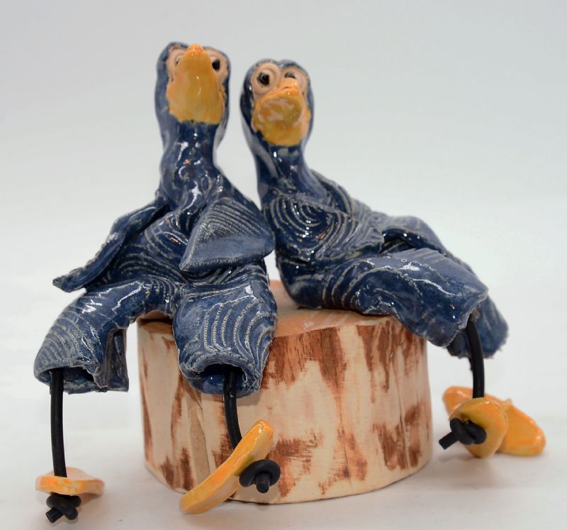 To fugle på træstub