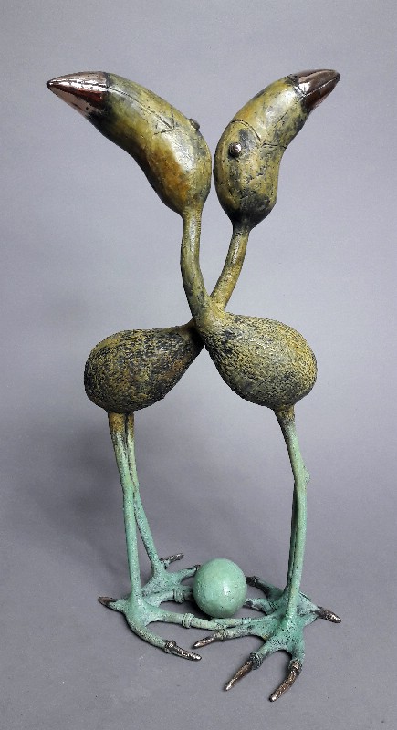 Green Legged Birds With An Egg
