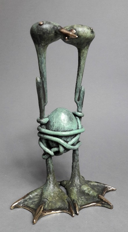 Small Birds With An Egg