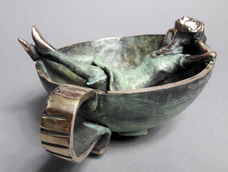 Girl Laying In A Cup